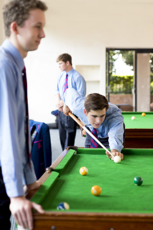 boys playing snooker
