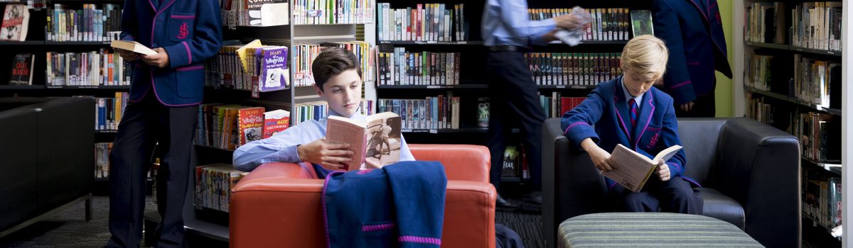 boys in library reading